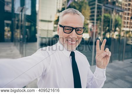 Photo Of Optimistic Grey Hair Old Business Man Show V-sign Do Selfie Wear Spectacles White Shirt Out