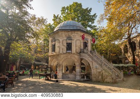 Bursa, Turkey - October 14, 2019: Tea gardens and silk shops in Koza Han Silk Bazaar. Koza Han is historical place from Ottoman times in Bursa, Turkey