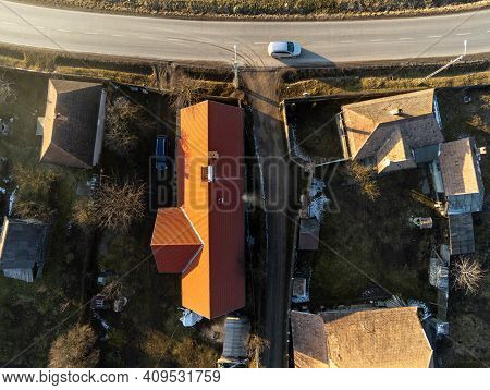 Solar Water Heater Boiler On Rooftop  Aerial Drone View, Passing Car On The Asphalt Road.