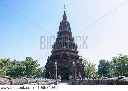 A Beautiful Pagoda In The Middle Of A Pond In A Buddhist Temple In Thailand.