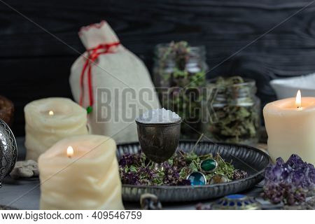 Magic Altar With Mystical Herbs, Salt, Candles And Crystals. Witch Sanctuary Sacred Esoteric Concept