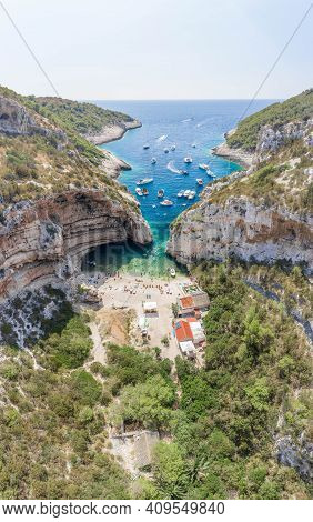 Aerial Drone Shot Of Iconic Stiniva Cove Beach Of Adriatic Sea On Vis Island In Croatia Summer