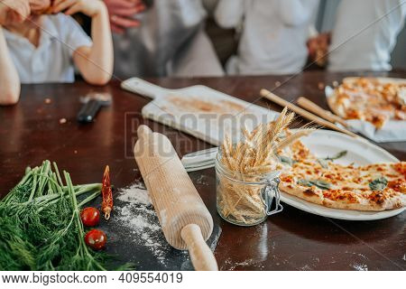Ogranic And Healthy Food And Vegetables. Rolling Pin With Flour On The Table In Modern Kitchen In Da