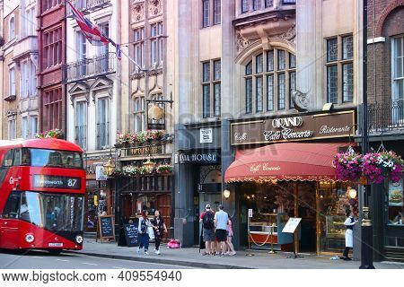 London, Uk - July 12, 2019: People Walk By Pubs And Cafes In Whitehall Area Of City Of Westminster, 