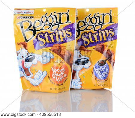 IRVINE, CA - January 05, 2014: Two packs of Purina Beggin Strips. One Bacon and Cheese Flavor and one Bacon Flavor product are shown. Purina is a leading pet food manufacturer.