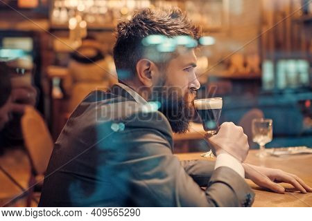 Alone Man Rest In Restaurant. Businessman With Long Beard Drink In Club. Serious Customer Sit In Caf