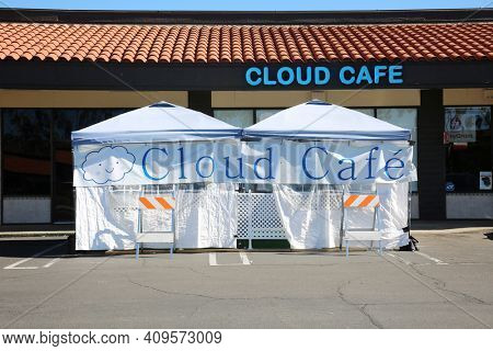 Lake Forest, California - USA - February 22, 2021: Outdoor Restaurant Dining. Restaurants are forced to set up outside tents and enclosures for dining due to the Coronavirus Pandemic Restrictions.  
