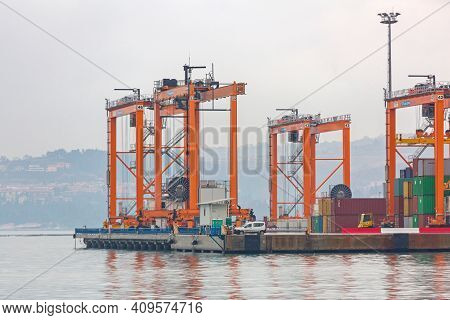 Koper, Slovenia - January 13, 2017: Container Cranes At Cargo Port In Koper, Slovenia.
