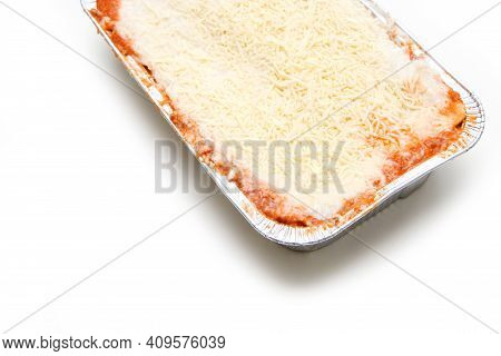 The Semifinished Lasagne In The Aluminium Tub Isolated On A White Background. The Fast Ready To Cook