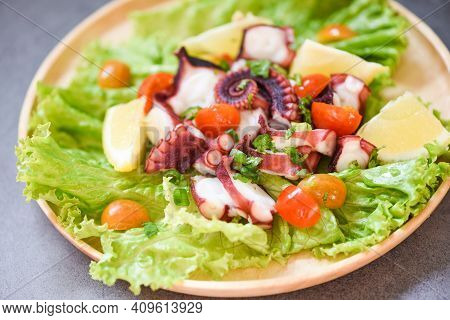 Octopus Salad With Lemon Tomatoes And Vegetables On Wooden Plate Fresh And Healthy Salad Seafood Squ