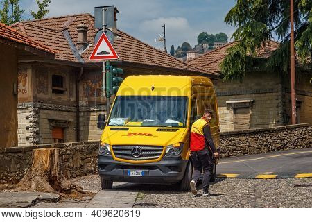 Bergamo, Italy - May 22, 2019: Minivan Of The Dhl Company. Dhl International Gmbh Is A German Courie