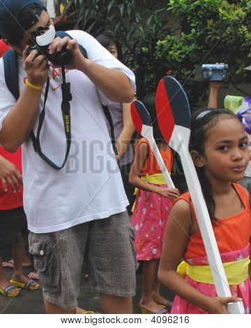 A Photographer During A Parade