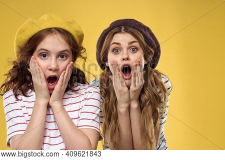 Funny Mom And Daughter Wearing Hats Fashion Fun Joy Family Yellow Background