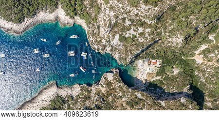 Aerial Panoramic Overhead Drone Shot Of Yachts At Adriatic Sea Tourists At Stiniva Beach On Vis Isla