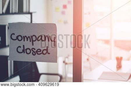 Company Closed On Windows Of An Empty Office For Out Of Business By Economic Recession Concept.