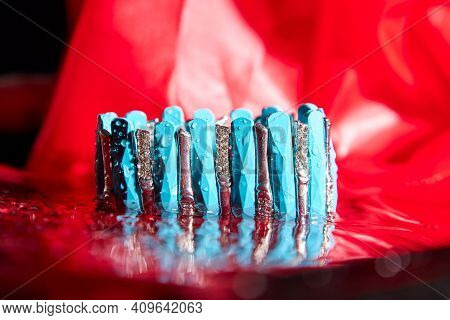Beautiful Blue Bracelet In The Water. The Concept Of Beautiful Female Decorations