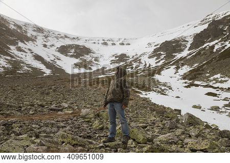 Stock Photo Of A Man Wearing Camouflage Clothing, And Trekking In The High Mountain Of Moncayo In Ar