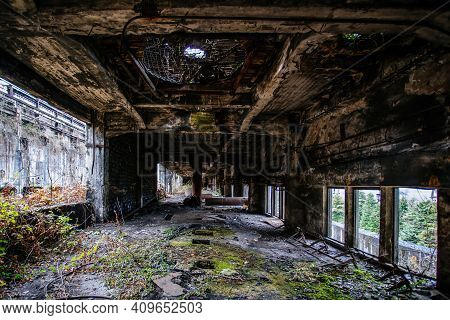 Overgrown Ruins Of Industrial Building. Abandoned, Destroyed By War Power Plant In Tkvarcheli Tquarh