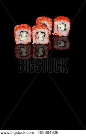 Philadelphia Roll With Salmon, Cheese And Cucumber On A Black Background With Reflection. Sushi Phil