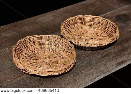 Rattan Wicker Basket On Old Wood Table . Handmade