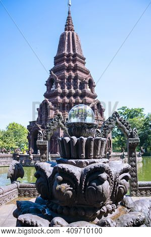 A Beautiful Pagoda In The Middle Of A Pond In A Buddhist Temple In Thailand.