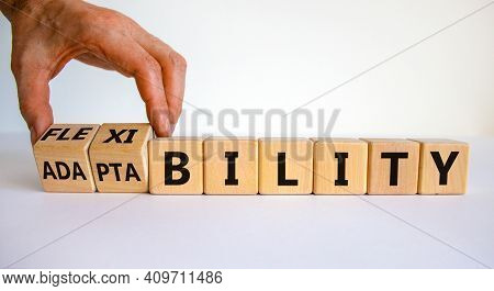 Flexibility And Adaptability Symbol. Businessman Turns Wooden Cubes And Changes Words 'adaptability'