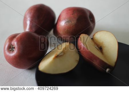 The Red Bartlett Pear Carries A True Pyriform Pear Shape. A Rounded Bell On The Bottom Half Of The F
