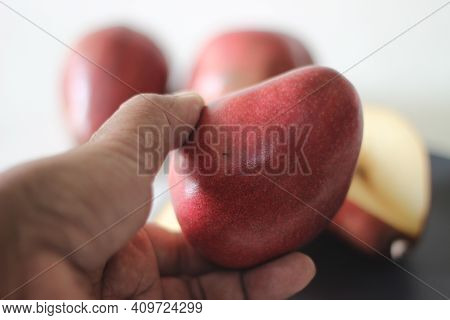 The Red Bartlett Pear Carries A True Pyriform Pear Shape. A Rounded Bell On The Bottom Half Of The F