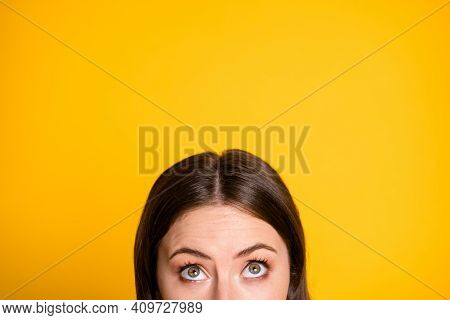 Cropped Photo Of Astonished Girl Look Up Copyspace Indicate Ads Isolated Over Yellow Color Backgroun