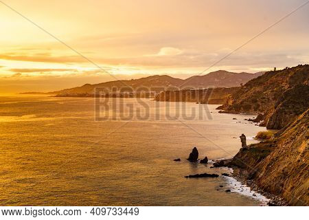 Spanish Coast At Sunset, Seaside Cliffs Of Maro Cerro Gordo. Costa Del Sol, Andalusia Spain.