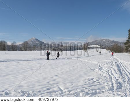 Czech Republic, Cvikov, January 25, 2021: Group Of People, Skiers On Ski Run Trail At Winter Field I