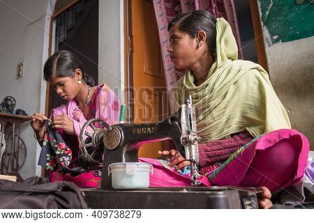 Rajasthan. India. 07-02-2018. Group Of Young Woman Are Receiving Sewing Lessons In Their Village, As