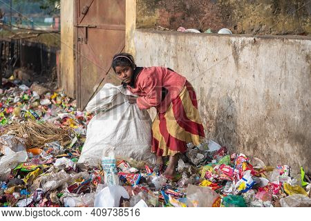 Uttar Pradesh. India. 07-02-2018. A Girl Is Collecting Plastic From The Street To Sell It And Receiv