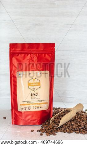 Tiraspol, Moldova - February, 12, 2021 Red Coffee Bag With Degassing Valve. Coffee Beans 100% Arabic