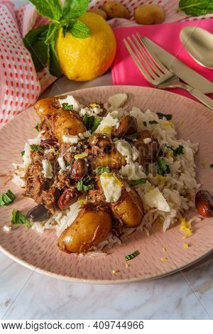 Greek Shredded Lamb Stew Marinated In A White Wine Salmoriglio Sauce With New Potatoes Kalamata Oliv