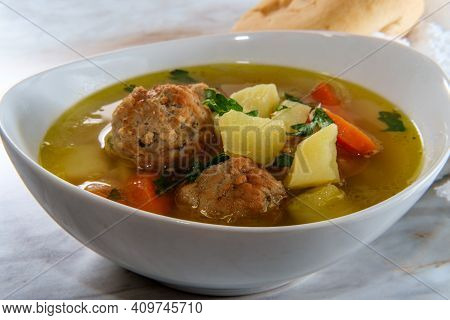 Russian Frikadeller Meatball Soup With Potatoes And Parsley Garnish
