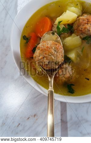 Russian Frikadeller Meatball Soup With Potatoes And Parsley Garnish