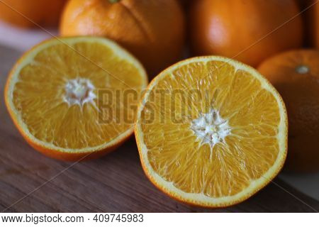 Kinnows And Sliced Kinnows Which Looks Like Orange