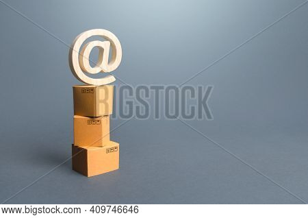 Tower Of Boxes And Email Internet Symbol. Online Internet Distribution Of Goods. E-commerce. Network