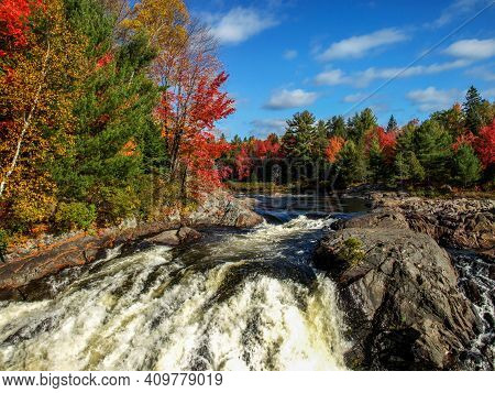 Rolling Clouds And Blue Sky Add To The Beauty Of The Fall Scene, Chutes Prov Park, On, Canada