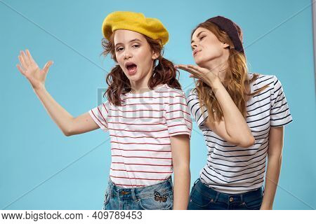 Mom And Daughter Striped T-shirts Hugs Fun Lifestyle Blue Background