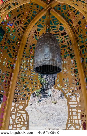 Chungbuk, South Korea;feb.21, 2021: Bronze Bell In Housing Sculpted From Metal Shaped In Korean Alph