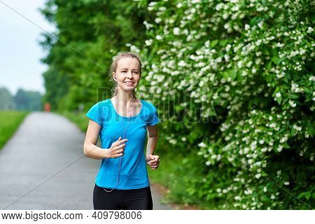 Running Woman Atletic Spotsman Training In The Summer Park. Outdoor Fitness Portrait