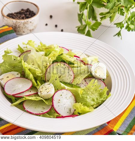Healthy Vegetables Salad With Cucumbers, Quaill Eggs And Radish. Closeup