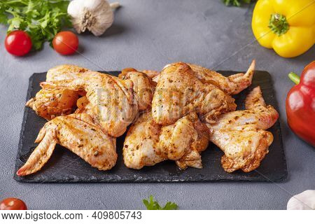 Marinated Chicken Wings In Red Sauce. Raw Chicken Wings Ready To Cook