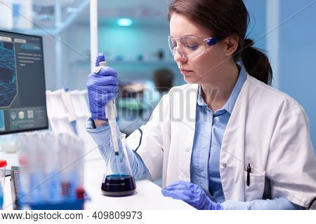 Scientist Doctor In White Coat Discovering Genetic Infection And Analysing Micropipette. Woman Resea