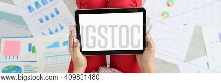 Woman Is Sitting On Floor Around Documents With Charts With Commercial Indicators Holding Tablet In 