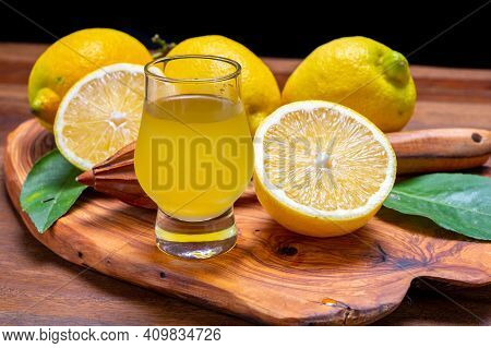 Ice Cold Sweet Limoncello Liqueur Made From New Harvest Of Fresh Ripe Yellow Italian Lemons, Amalfi