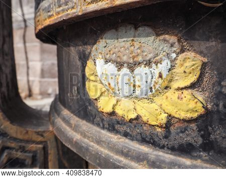 Blooming Lotus Flower On An Ancient Black Metal Incense Burner In A Chinese Temple