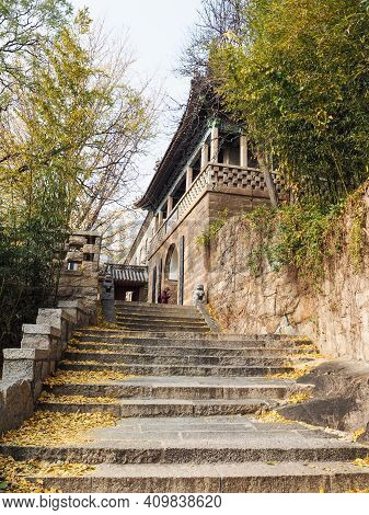 Qingdao, China - December 2017: Stairs Leading Up To The Huayan Temple In The Yanku Scenic Area At M